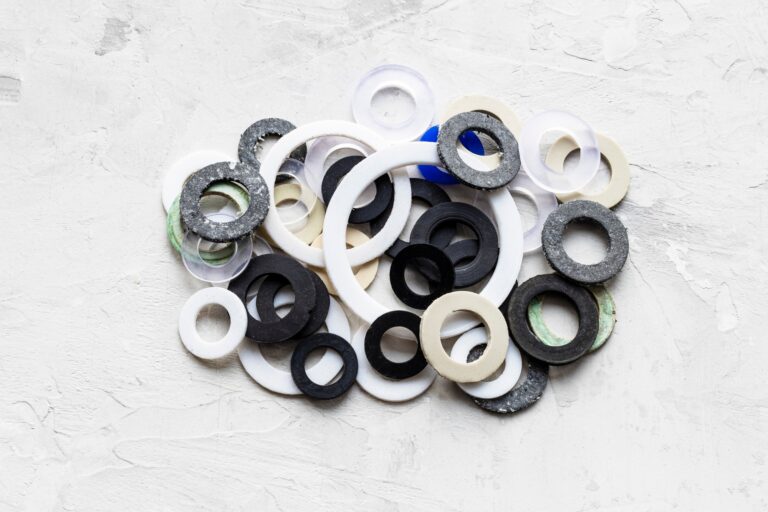 pile of various gaskets for plumbing water systems